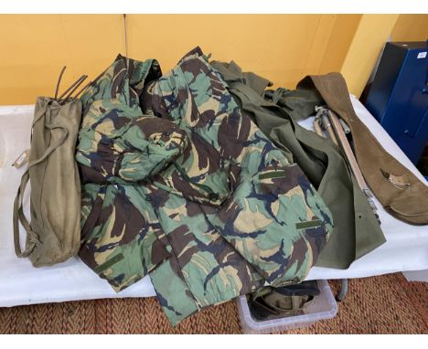 A CAMP BED, CAMERA STAND, CAMOUFLAGE CLOTHING ETC 