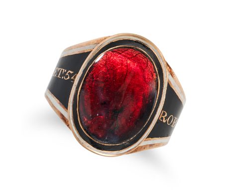 AN ANTIQUE GEORGIAN GARNET AND ENAMEL MOURNING RING in yellow gold, set with a cabochon garnet in a border of black and white