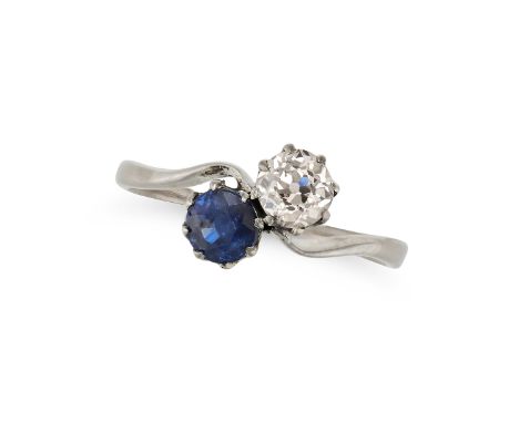 A SAPPHIRE AND DIAMOND TOI ET MOI RING in white gold, set with a round cut sapphire of approximately 0.78 carats and an old E