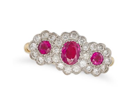 A RUBY AND DIAMOND DRESS RING in 18ct yellow gold, set with three cushion and round cut rubies in a cluster of round brillian