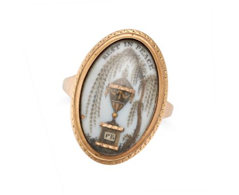 AN ANTIQUE GEORGIAN MOURNING RING in yellow gold, the navette shaped face with a hairwork scene of an urn with the initials P