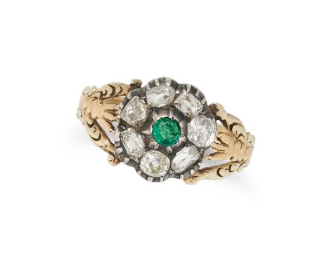 AN ANTIQUE EMERALD AND DIAMOND CLUSTER RING in yellow gold and silver, set with a round cut emerald in a cluster of old cut d