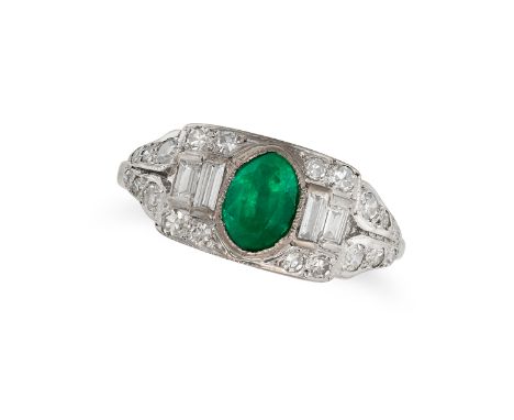 AN EMERALD AND DIAMOND DRESS RING in white gold, set with an oval cut emerald of approximately 0.87 carats, accented on each 