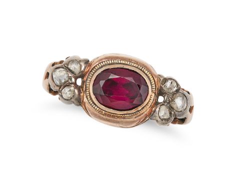 AN ANTIQUE GARNET AND DIAMOND RING in rose gold and silver, set with an oval cut garnet accented on each side by trios of ros