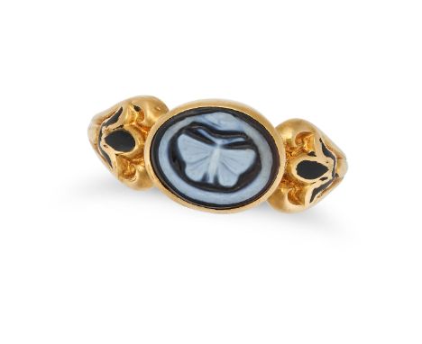 AN ANTIQUE BANDED AGATE CAMEO AND ENAMEL MOURNING RING in yellow gold, set with a banded agate cameo carved to depict a butte