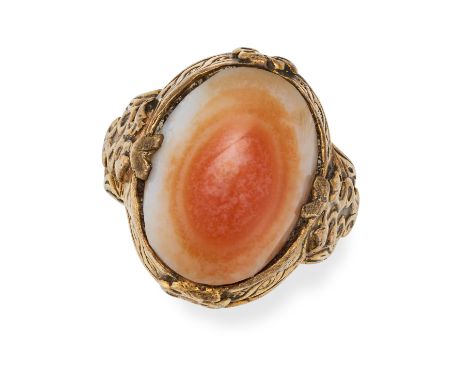 AN ANTIQUE AGATE DRESS RING set with a cabochon cut agate to scrolled detailed setting and shoulders, no assay marks, size Q1