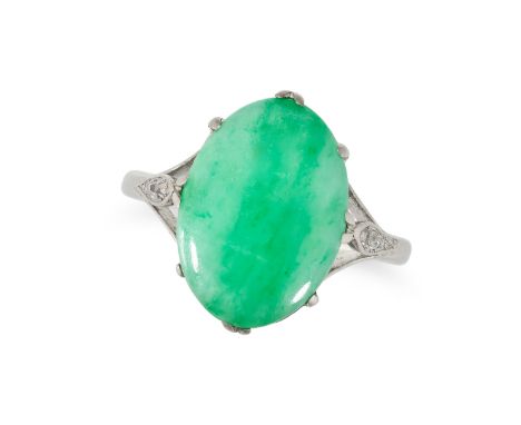 A JADEITE JADE AND DIAMOND RING in platinum and 18ct white gold, set with an oval cabochon jadeite jade, the shoulders set wi