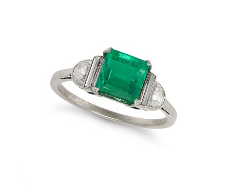 AN EMERALD AND DIAMOND RING in platinum, set with an octagonal step cut emerald of approximately 1.75 carats, the shoulders s