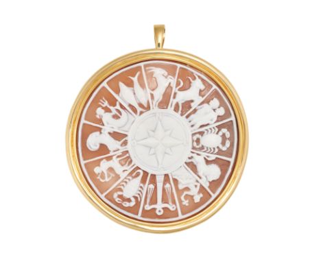 A SHELL CAMEO ZODIAC CALENDAR BROOCH / PENDANT in yellow gold, the shell cameo carved to depict the zodiac calendar around a 