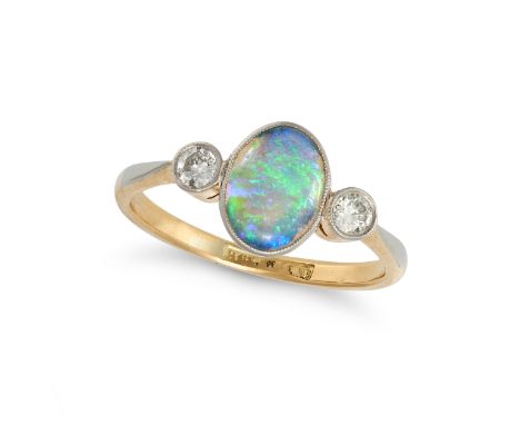 AN OPAL AND DIAMOND RING in 18ct yellow gold and platinum, set with an oval cabochon opal accented on each side by a transiti