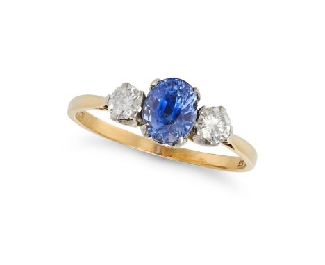 A SAPPHIRE AND DIAMOND THREE STONE RING in 18ct yellow gold, set with an oval cut sapphire of approximately 1.35 carats, acce