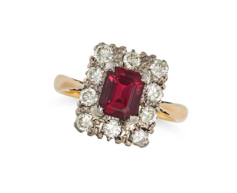 A GARNET AND DIAMOND CLUSTER RING in 18ct yellow gold, set with an octagonal step cut garnet of approximately 1.41 carats, in