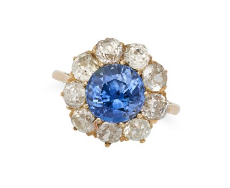 A SAPPHIRE AND DIAMOND CLUSTER RING in 18ct yellow gold, set with a round cut sapphire of approximately 2.97 carats in a clus