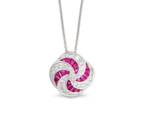 A RUBY AND DIAMOND PENDANT NECKLACE in 18ct white gold, the pendant in scrolling design, set with calibre cut rubies and roun