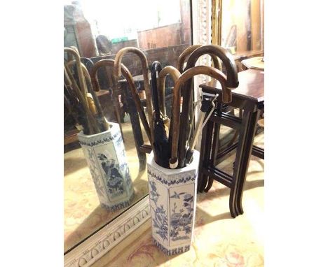 A modern Chinese blue and white stick stand, with a collection of canes or sticks (stand: 48cm)