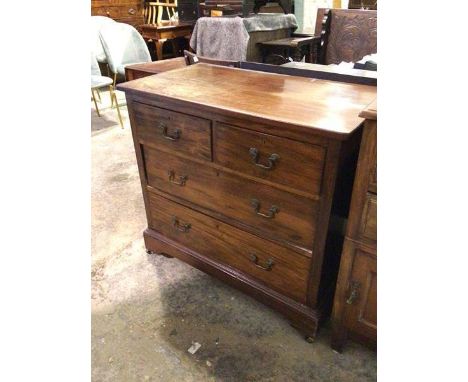 An Edwardian mahogany chest of drawers, the rectangular top above two short and two long drawers, on bracket feet ending in c