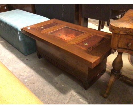 A modern Chinese bijouterie table, the rectangular top with central display area, the glass top and copper interior, flanked 