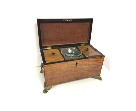 A Regency mahogany tea caddy, the interior with original tea cannister lids (lacking lead liners and original mixing bowl), w