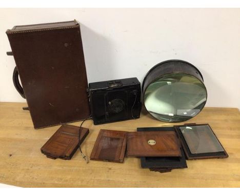 A C.F. Goerz glass plate negative camera with additional slides, one marked Morgan and Kidd, Richmond, London and a large gla