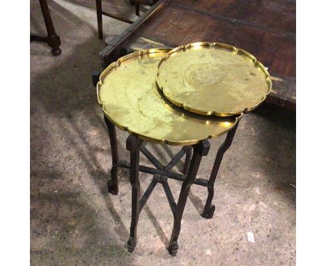 A Chinese brass tray on stand, the tray with raised scalloped edge with engravings depicting two figures in a garden, along w