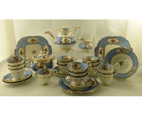 AN EXTENSIVE VICTORIAN TEASET, blue border with gilded cartouches of hand painted summer flowers comprising; teapot and cover