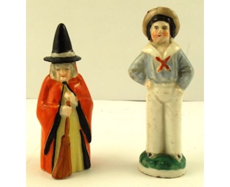 AN EARLY 20TH CENTURY ROYAL WORCESTER CANDLE SNUFFER IN THE FORM OF A WITCH, puce factory mark with no. 2543, 9cm high, toget