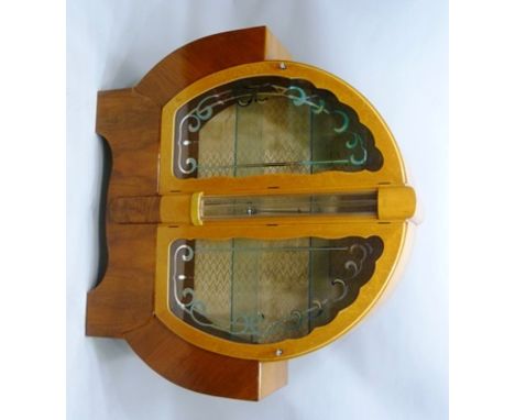 AN ART DECO STYLE BURRWOOD VENEERED DISPLAY CABINET, having twin decorative glazed doors flanking "glass bar" central panel, 