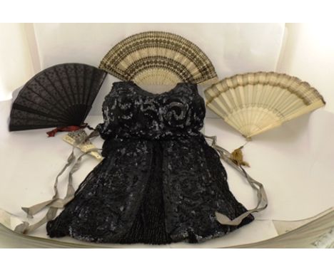 A 1920'S BLACK AND SEQUINNED LADY'S PARTY DRESS and an assortment of four fans, one bone, gilt braid and tassel and another w