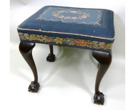 AN EDWARDIAN DRESSING TABLE STOOL, having floral tapestry upholstered seat, raised on cabriole ball and claw supports, 