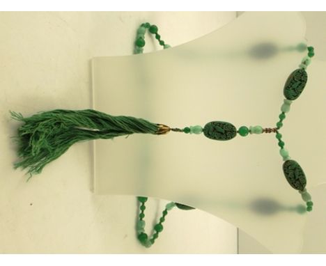 A JADE & GREEN CINNABAR NECKLACE fashioned with carved bird ovals, 80cm long 