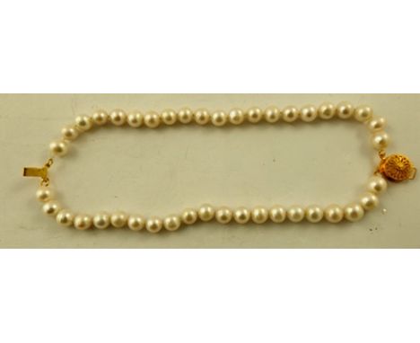 A CULTURED PEARL UNIFORM TWO-ROW BRACELET, on gilt metal clasp, 19cm long 
