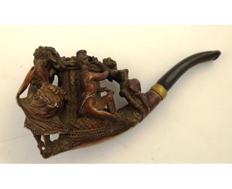 A CARVED MEERSCHAUM PIPE fashioned with two ladies and two mischievous gentlemen around a trunk 