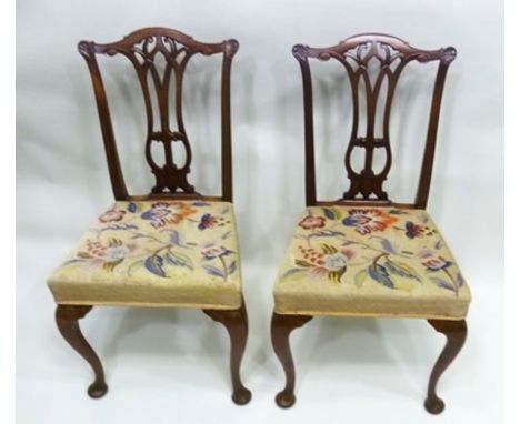 A PAIR OF EDWARDIAN MAHOGANY SINGLE CHAIRS, having floral tapestry seats, raised on cabriole fore supports, 