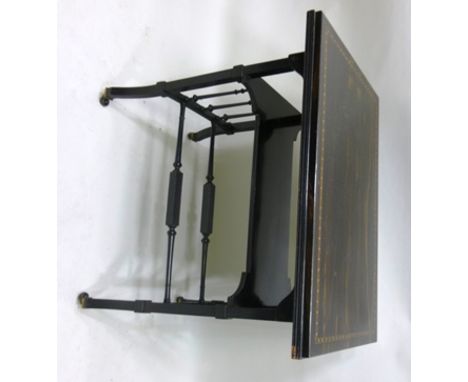 A VICTORIAN EBONISED OCCASIONAL TABLE having rectangular later applied coromandel and inlaid top, splayed supports, turned st