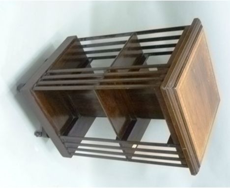 A LATE VICTORIAN/EDWARDIAN MAHOGANY REVOLVING BOOKCASE, the top crossbanded and boxwood inlaid, slatted sides, two tiers on a