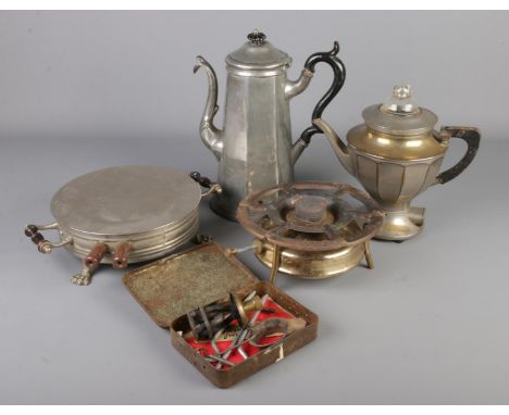 A collection of metalwares. Includes Svea 106 stove, Archer System plate warmer, Cartwright &amp; son hot water pot and a vin
