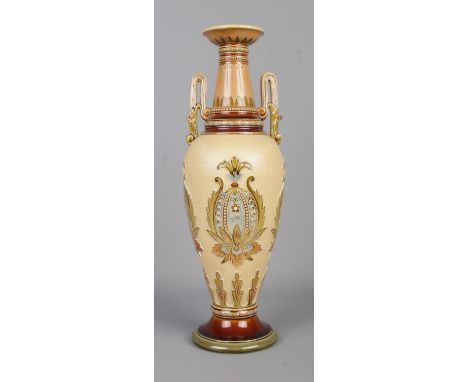 A Mettlach, Villeroy and Boch twin handled vase, pattern 2505. Decorated with floral panels and beaded neck. Height: 33.5cm. 