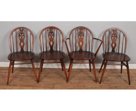 Four 1960s retro Ercol dining chairs, including one carver chair, with impressed marks beneath the seats. Size: W43 x D46 x H