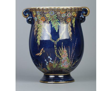 A Crown Devon Fieldings blue ground vase featuring gilt rim and scrolled handles, depicting wisteria and flowers surrounded b