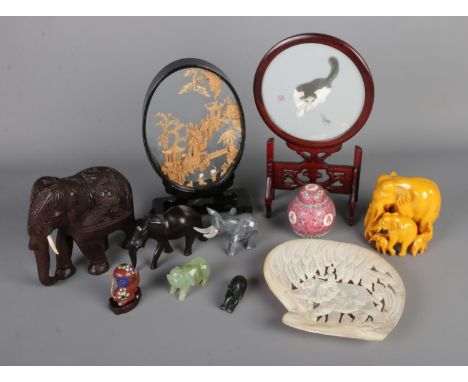 A collection of mainly oriental collectables to include cork diorama, small cloisonne monkey, collection of carved animals (m