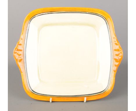A Clarice Cliff Newport Pottery square sandwich plate. With orange, yellow and blue border. Bearing Brice Rogers Cottage Pott