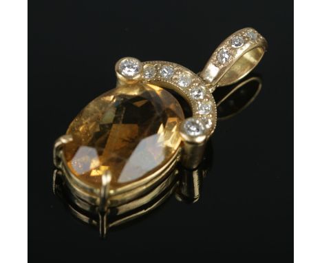 An 18ct yellow gold mounted citrine and diamond pendant; the faceted citrine below diamond set shoulders. Length: 2.8cm. Tota