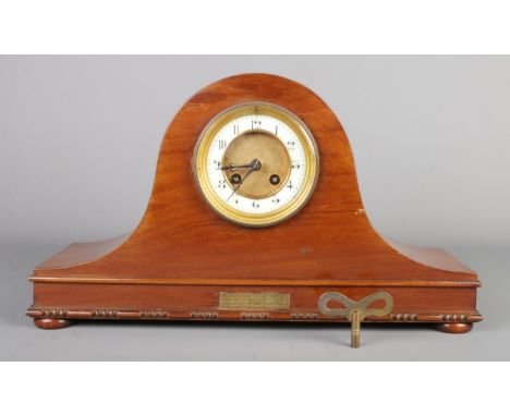 An antique Napoleon hat style inlaid mantel clock, circular brass dial with enamel chapter ring bearing Arabic numerals, engr