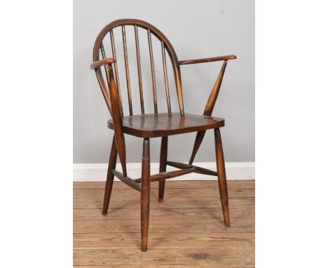 An Ercol Model 370A elm and beech armchair.