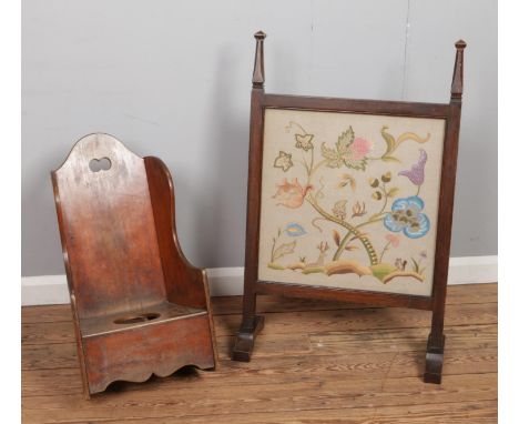 A child's mahogany rocking commode, along with a floral embroidered fire screen.