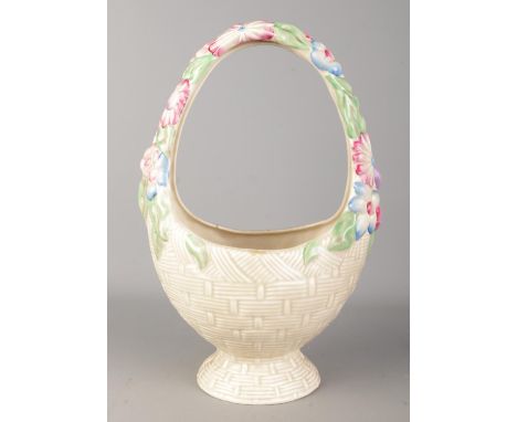 A Clarice Cliff Newport Pottery basket vase with floral decoration. Height 35cm.