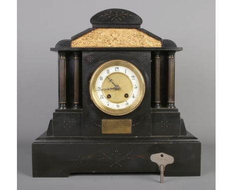 An antique German black slate mantel clock by HAC (Hamburg-Amerikanische Uhrenfabrik), featuring architecture design and circ