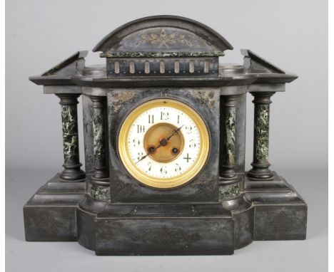 A large antique French black slate and marble mantel clock by Jules Rolez Limited Paris, featuring architecture design with p