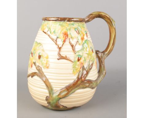 A large Carlton Ware ceramic pitcher/jug decorated in the Day Oak pattern, 1146. Height 22cm.