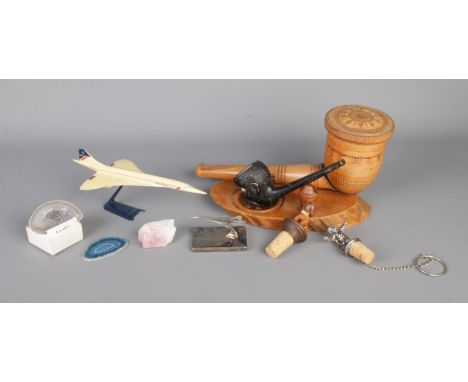 A quantity of collectables, to include tobacco box and pipe stand, Concorde models, polished crystals and novelty wine corks 